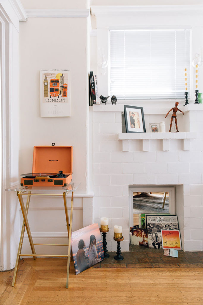 the-everygirl-julia-goodwin-home-tour-office-record-player-and-fireplace